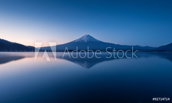 Picture of mountain Fuji at dawn with peaceful lake reflection